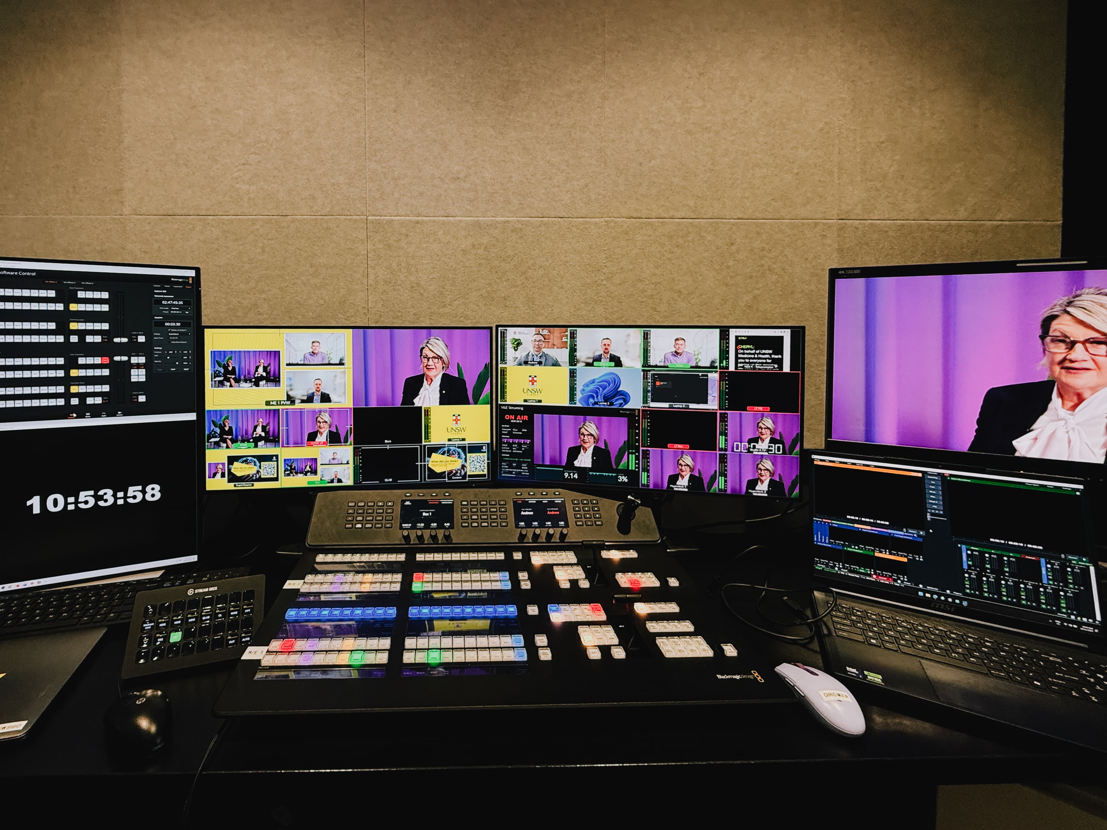 Production control desk with multiple monitor feeds managing a multicam livestream.